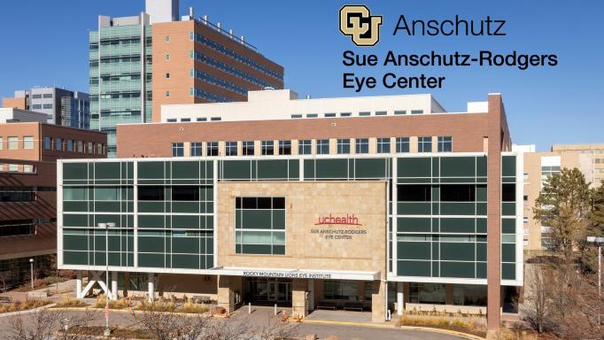 Photo of the CU (University of Colorado) Anschutz Sue Anschutz-Rogers Eye Center building with their logo superimposed over a bright blue sky.